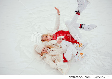 Cute and beautiful family in a winter city Cute and beautiful family in a winter city 58545796