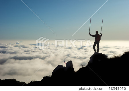 From the peak of a mountain observing the sea of From the peak of a mountain observing the sea of 58545950