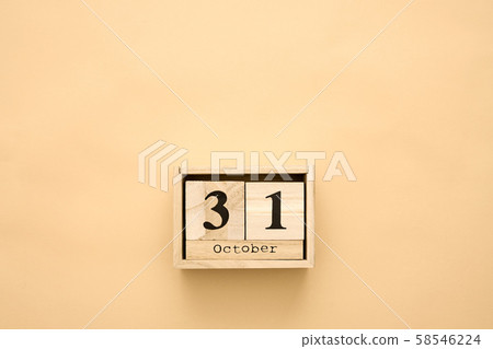 Halloween day 31 october in wooden calendar on beige background. Copy space, holiday concept 58546224