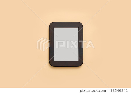 Ebook mockup with empty screen on beige background. Top view flat lay. Student or school library 58546241
