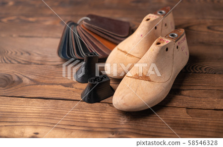 Leather samples for shoes and wooden shoe last on 58546328