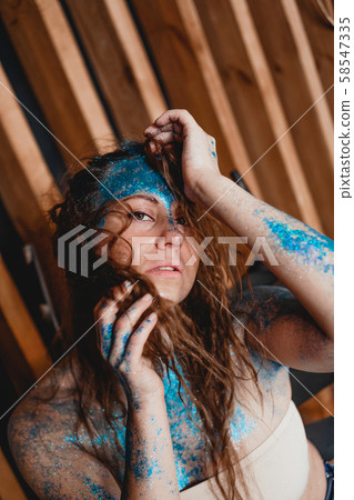 Portrait of beautiful woman with sparkles on her face. Girl with art make up Portrait of beautiful woman with sparkles on her face. Girl with art make up 58547335