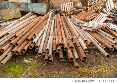 Scrap metal waste is stored in a recycling yard Scrap metal waste is stored in a recycling yard 58548734