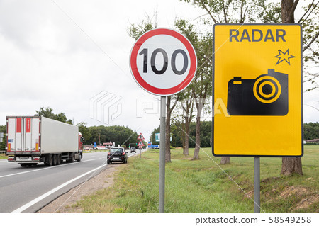 Roadsign Speen limitation one hundred km and tablet with radar gun Roadsign Speen limitation one hundred km and tablet with radar gun 58549258