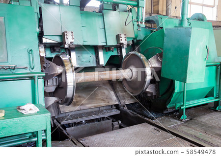 Rail wheelset in a lathe. Repair shop of railway 58549478