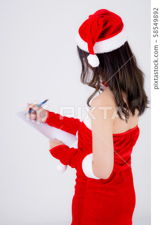 Beautiful portrait young asian woman writing notepad in xmas day isolated on white background Beautiful portrait young asian woman writing notepad in xmas day isolated on white background 58549892