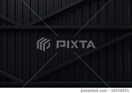 Black corrugated metal surface of iron gates Black corrugated metal surface of iron gates 58550053