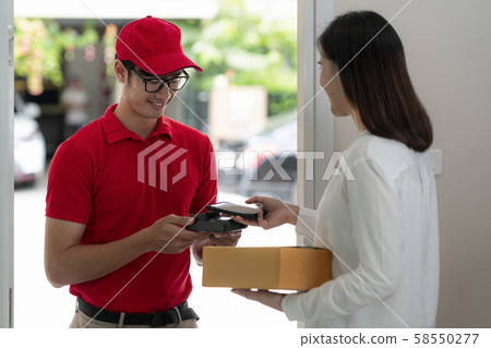 home delivery service man in red uniform 58550277