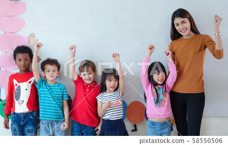 Teacher and student in an international preschool 58550506