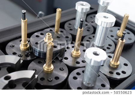 close shot of metal preparations of metal products on definite stage of processing close shot of metal preparations of metal products on definite stage of processing 58550623