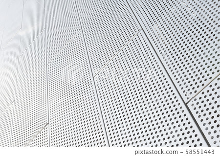 Metal grilles with many round holes in the ceiling background. Dot pattern on surface, diagonal view Metal grilles with many round holes in the ceiling background. Dot pattern on surface, diagonal view 58551443