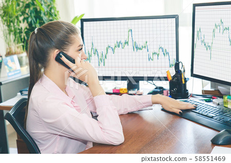 Girl stockbroker trades online by taking orders 58551469