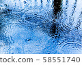 Ripples on the rainy road 58551740