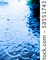 Ripples on the rainy road 58551743