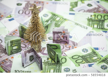 miniature gold toy fir tree money table background miniature gold toy fir tree money table background 58554818