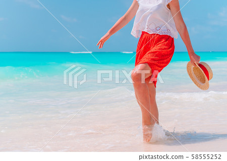 Close up of female feet on white sand beach Close up of female feet on white sand beach 58555252
