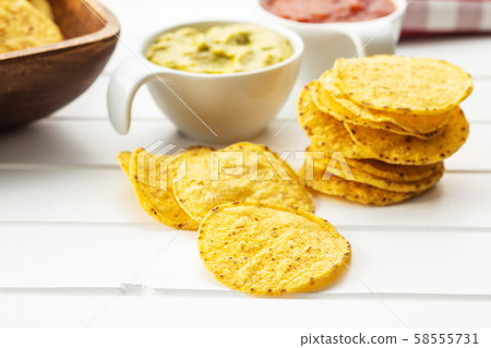 Round nacho chips. Yellow tortilla chips 58555731