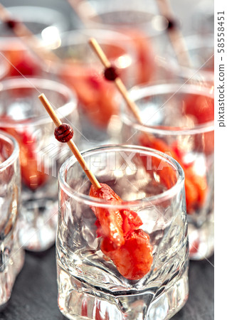 close-up canape with shrimp in glass soft background 58558451