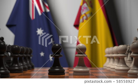 Chess game against flags of Australia and Spain. Political competition related 3D rendering 58558927