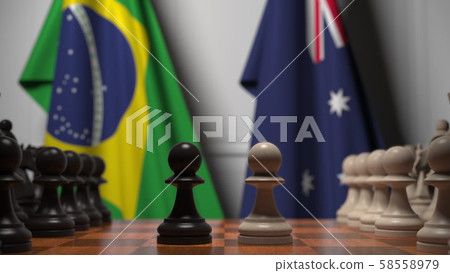 Chess game against flags of Brazil and Australia. Political competition related 3D rendering 58558979