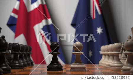 Chess game against flags of Great Britain and Australia. Political competition related 3D rendering Chess game against flags of Great Britain and Australia. Political competition related 3D rendering 58558982