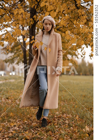 Beautiful lady in autumn landscape Beautiful lady in autumn landscape 58562852