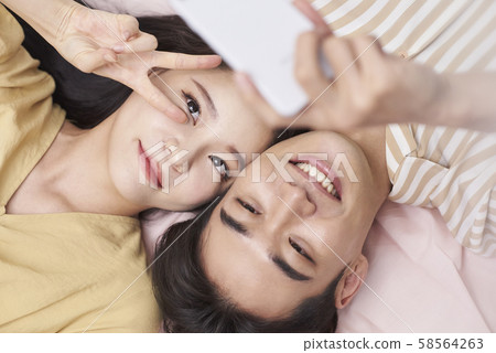 Lifestyle couple overhead view Lifestyle couple overhead view 58564263