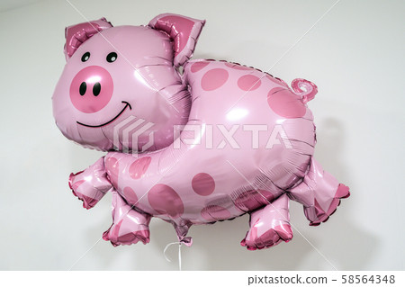 Inflatable pig shaped helium balloon on string white background lucky luck theme 58564348