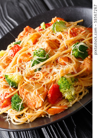 Italian pasta with broccoli, chicken, tomatoes and Italian pasta with broccoli, chicken, tomatoes and 58567267