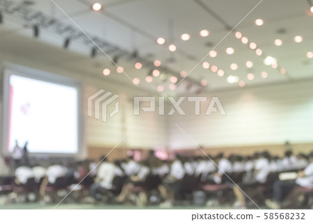 Blurred abstract background of business or educational conference and seminar in auditorium ha Blurred abstract background of business or educational conference and seminar in auditorium ha 58568232