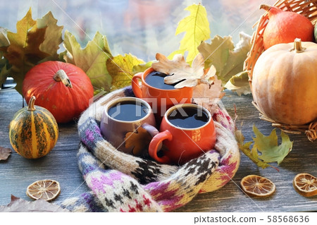Three cups of coffee, pumpkins, leaves Three cups of coffee, pumpkins, leaves 58568636