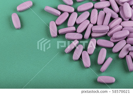 pills on a green background pills on a green background 58570021