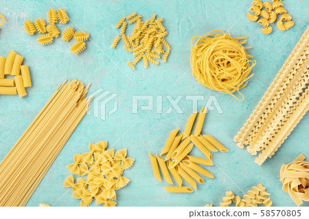 Italian pasta variety, flat lay banner, shot from the top on a teal blue background, a frame with a 58570805