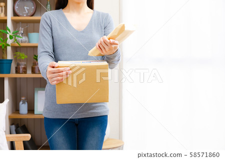Woman confirming mail Woman confirming mail 58571860