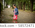 Kids playing on a rainy day 58572471