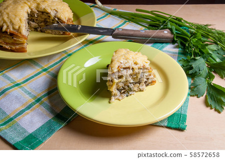 Piece of pancakes pie with mushrooms and chicken Piece of pancakes pie with mushrooms and chicken 58572658