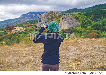 Woman take outdoor photo. Woman take outdoor photo. 58572720