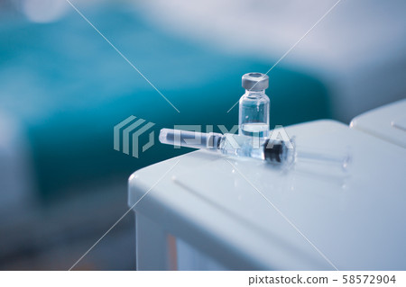 Vaccine vial dose flu shot drug needle syringe,medical concept vaccination hypodermic injection treatment disease care hospital prevention immunization illness disease  baby child.blue background  58572904