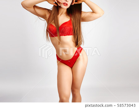 beautiful girl with a slim figure dressed with red beautiful girl with a slim figure dressed with red 58573043