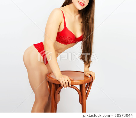 beautiful girl with a sports figure dressed in red beautiful girl with a sports figure dressed in red 58573044