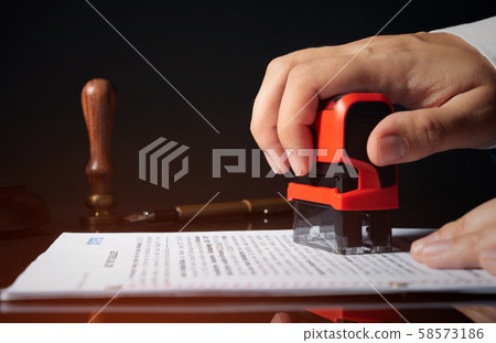 Attorney working with documents in office Attorney working with documents in office 58573186