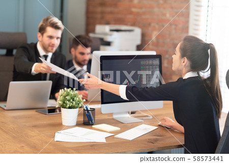 Financial employees are working on investments Financial employees are working on investments 58573441