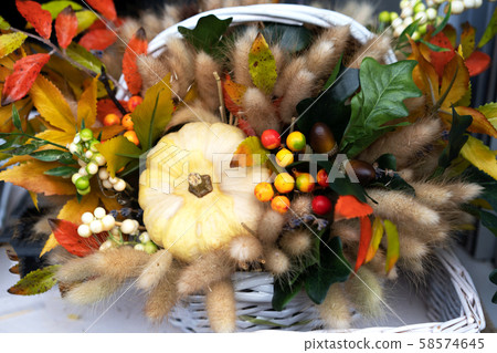 Small pumpkins, heather, beautiful autumn flowers decor for the harvest festival 58574645