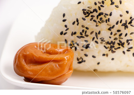 Plum dried (seasoned plum dried and honey flavored). With sesame salt rice balls. Plum dried (seasoned plum dried and honey flavored). With sesame salt rice balls. 58576097