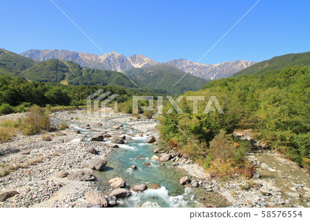 Hakuba foothills overlooking Hakuba mountain range from Hakuba Ohashi Hakuba foothills overlooking Hakuba mountain range from Hakuba Ohashi 58576554
