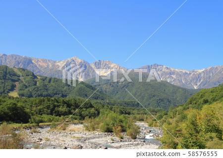 Hakuba foothills overlooking Hakuba mountain range from Hakuba Ohashi Hakuba foothills overlooking Hakuba mountain range from Hakuba Ohashi 58576555