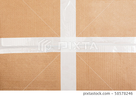 Cardboard box background with white sticky tape. Box packaging background Cardboard box background with white sticky tape. Box packaging background 58578246