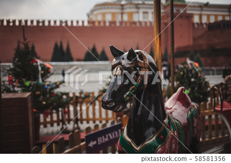Children's carousel at the New Year's fair in Moscow 58581356