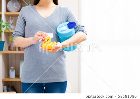 Caring for toys, wiping with sheets, bath toys, copy space Caring for toys, wiping with sheets, bath toys, copy space 58581386