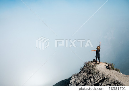 Woman in protective mask on active volcano Kawah 58581701